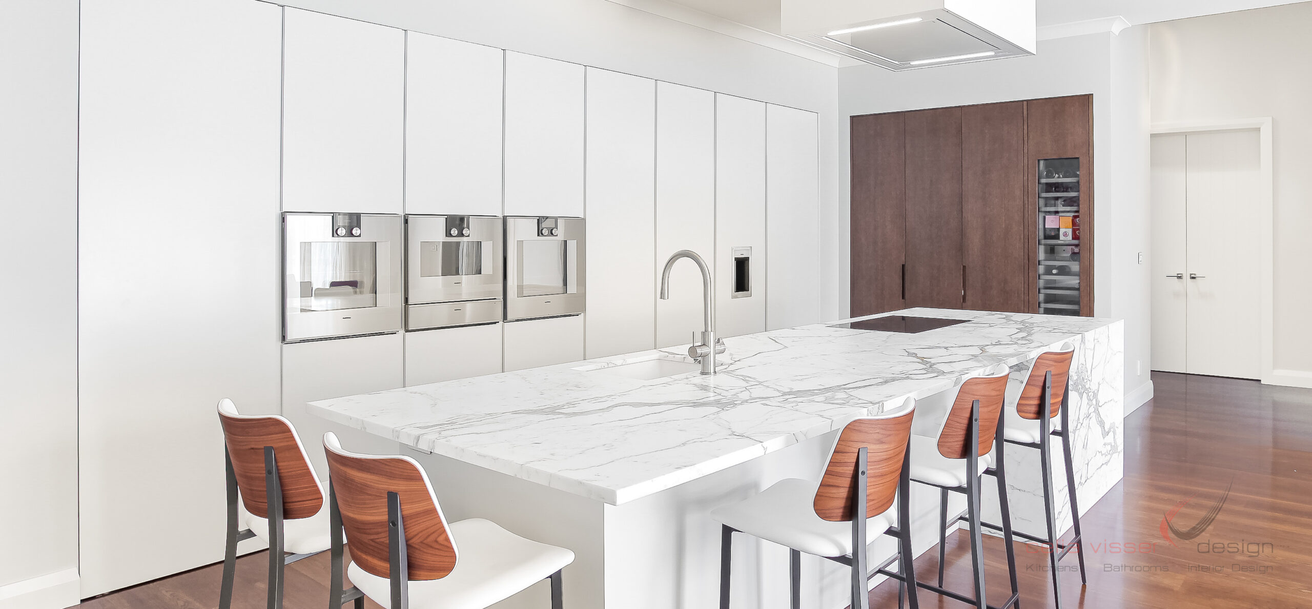 White kitchen design, white marble island